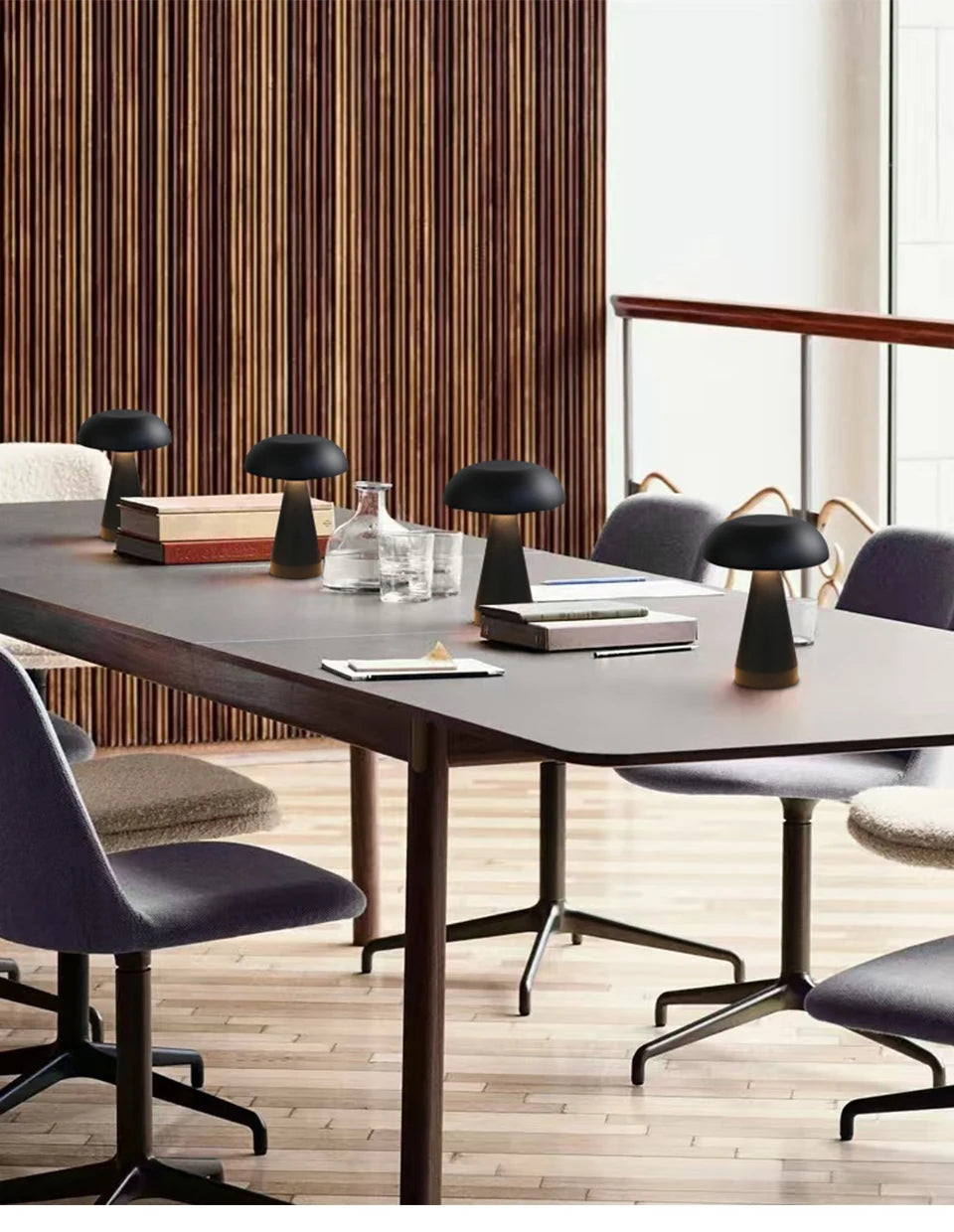 Modern conference room with mushroom table lamps in a well-lit office.