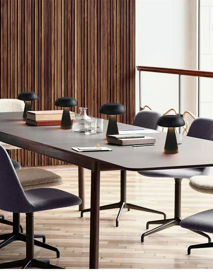 Modern conference room with mushroom table lamps in a well-lit office.