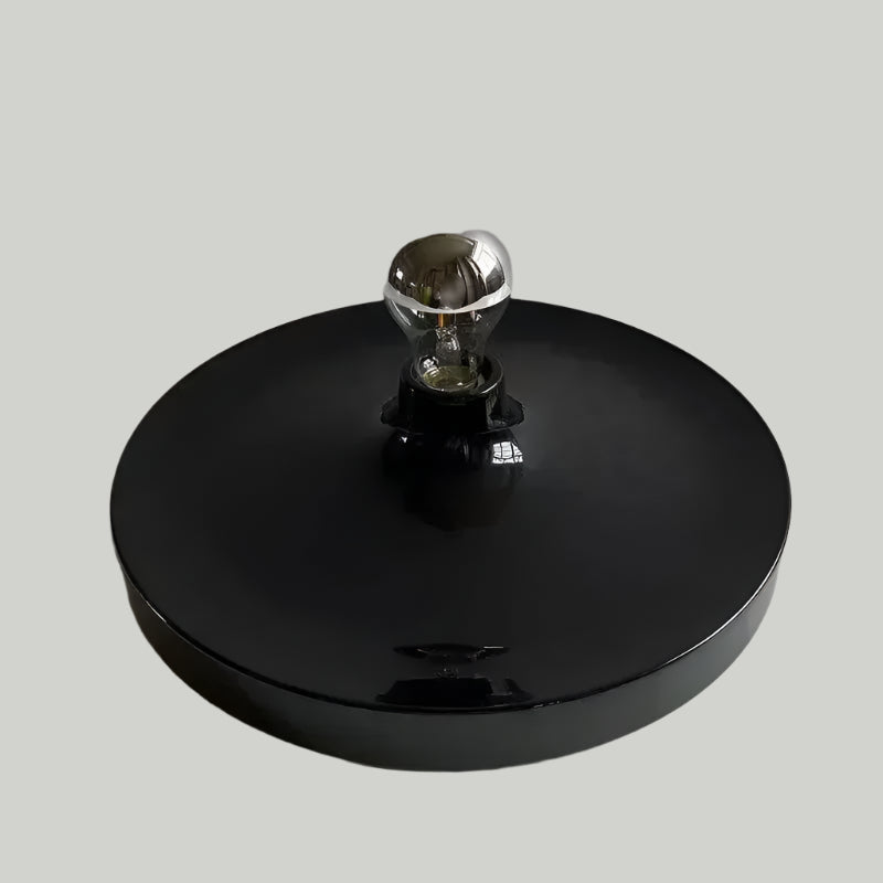 Black light fixture with a clear bulb on a white background