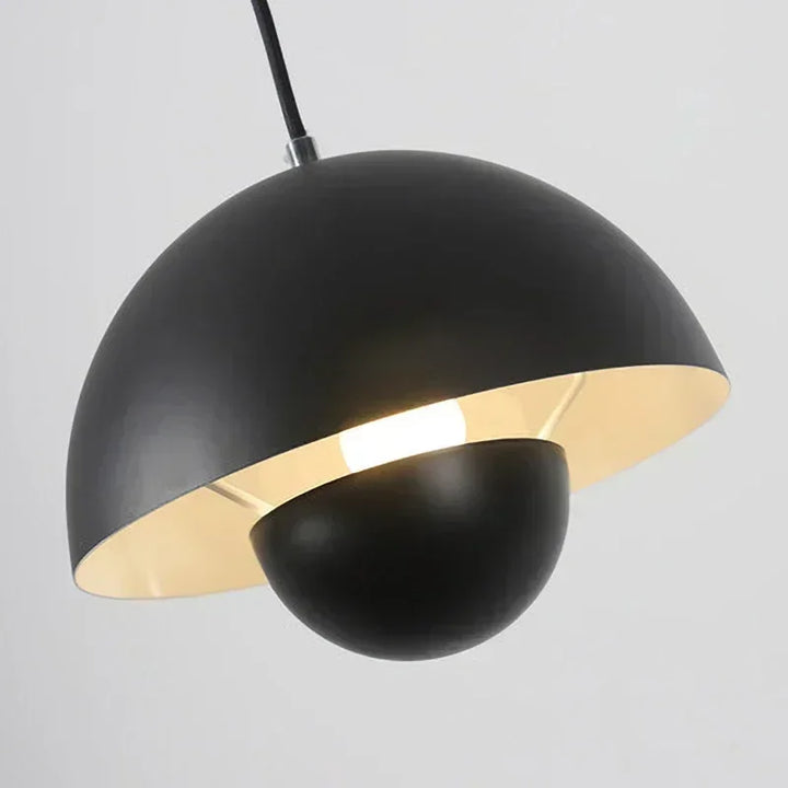 Black pendant light on a gray background