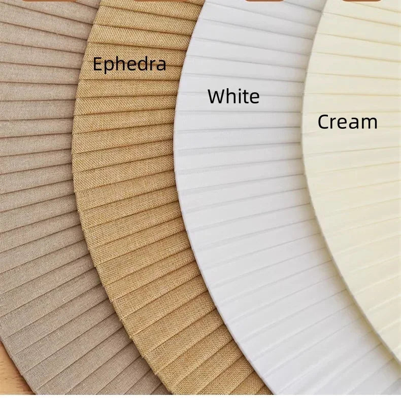 Three woven placemats labeled 'Ephedra', 'White', and 'Cream' arranged in a row.