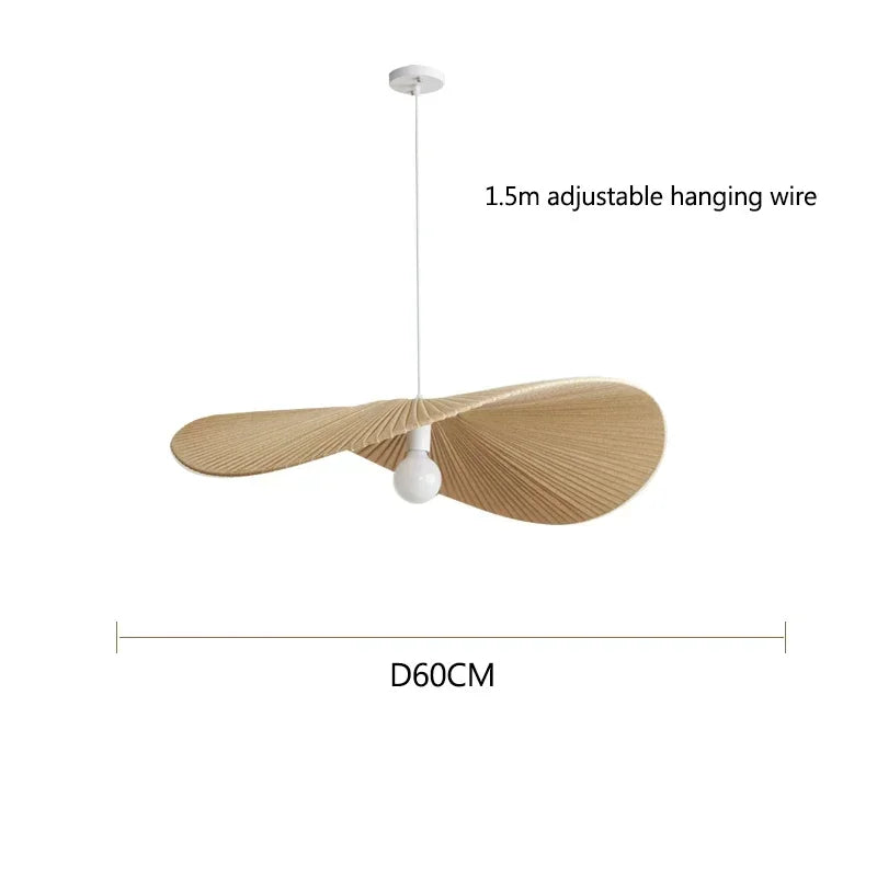 Decorative ceiling light fixture with adjustable hanging wire and white bulb on a white background