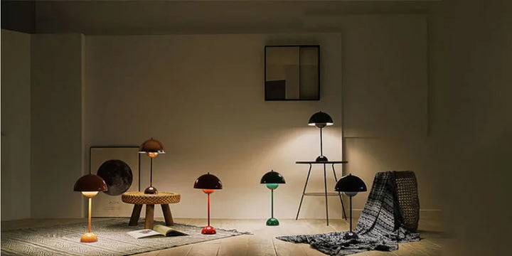 Modern interior with various lamps and a textured rug on a neutral background