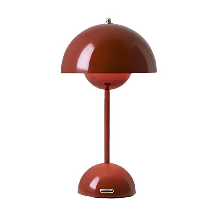 Red table lamp with a unique design on a white background