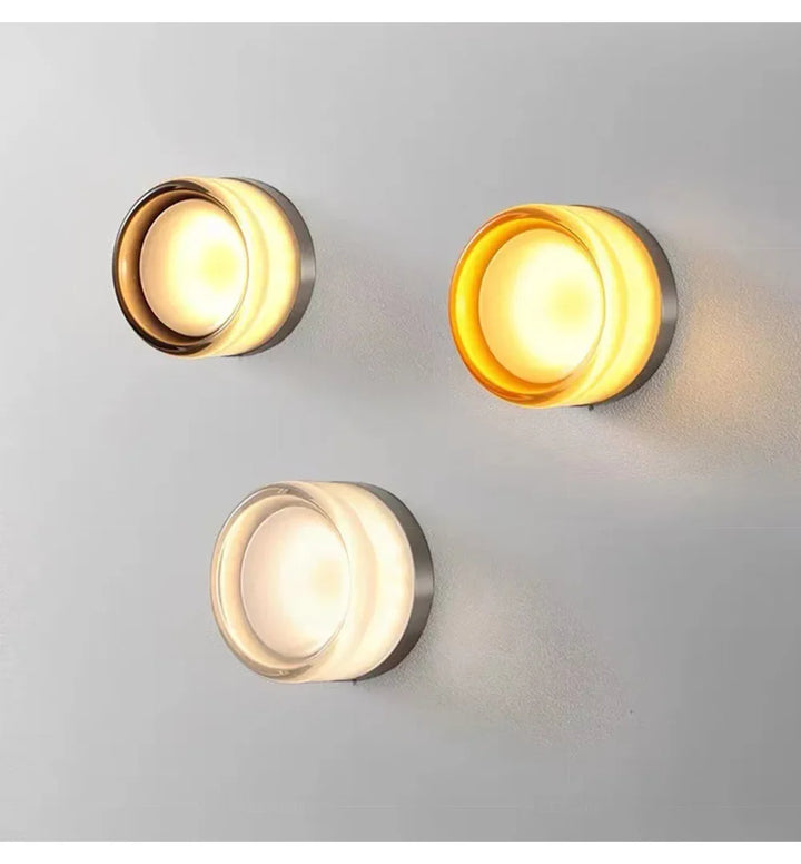 Three round ceiling lights on a gray background